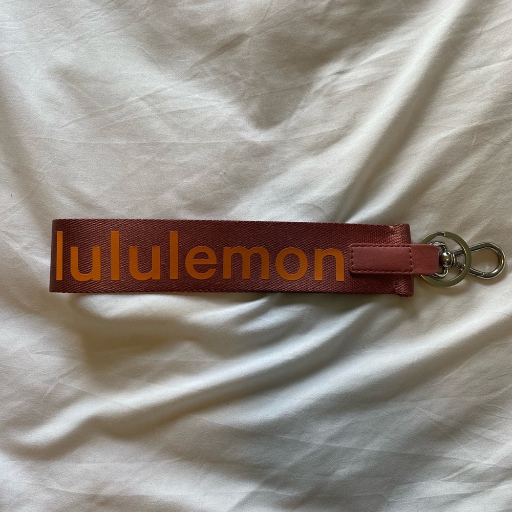 pink and orange LULULEMON key chain